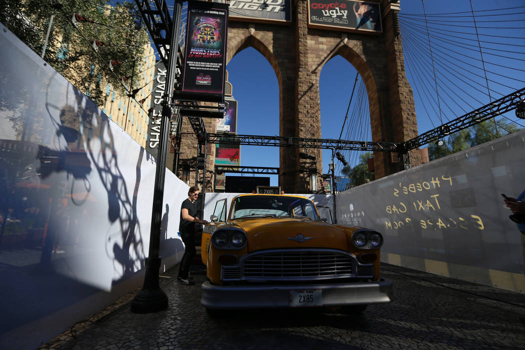 Experience designer Phillip Justman gets a 1981 checkered marathon cab ready for Phoebe's Yello ...