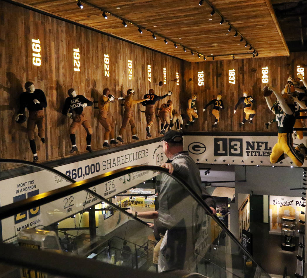 Fans explore Packer history inside the Green Bay Packers Hall of Fame at Lambeau Field in Green ...