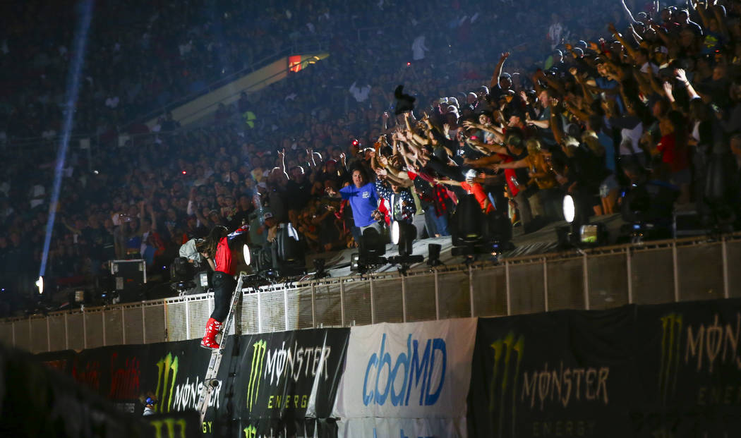 Malcolm Stewart, left, throws a jersey into the crowd after being introduced during the opening ...