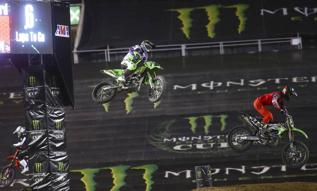 Eli Tomac (1) and Tyler Bowers (34) compete during the second round of the Monster Energy Cup S ...