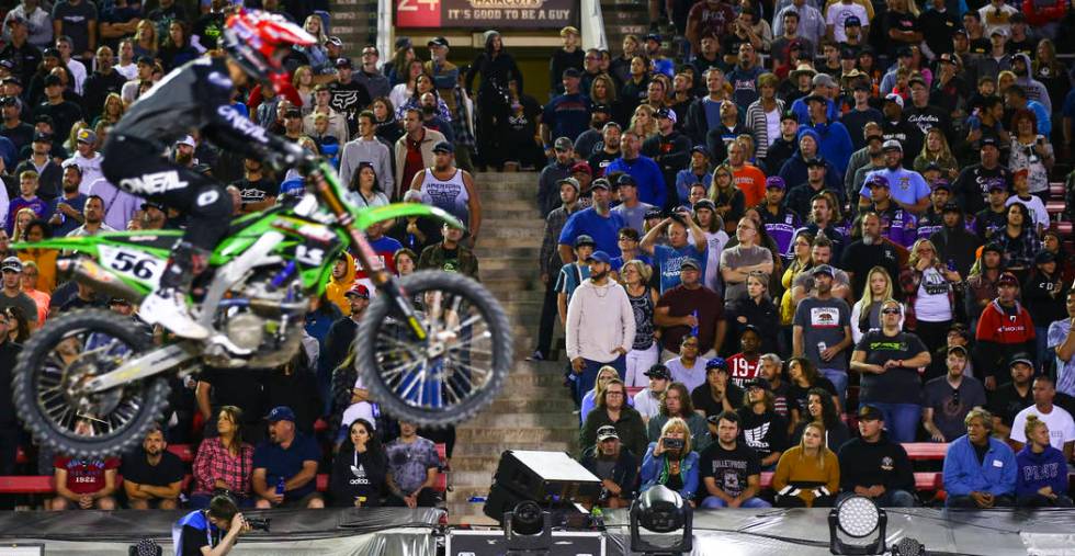 Fans watch Justin Starling (56) pass by during the third main event of the Monster Energy Cup S ...