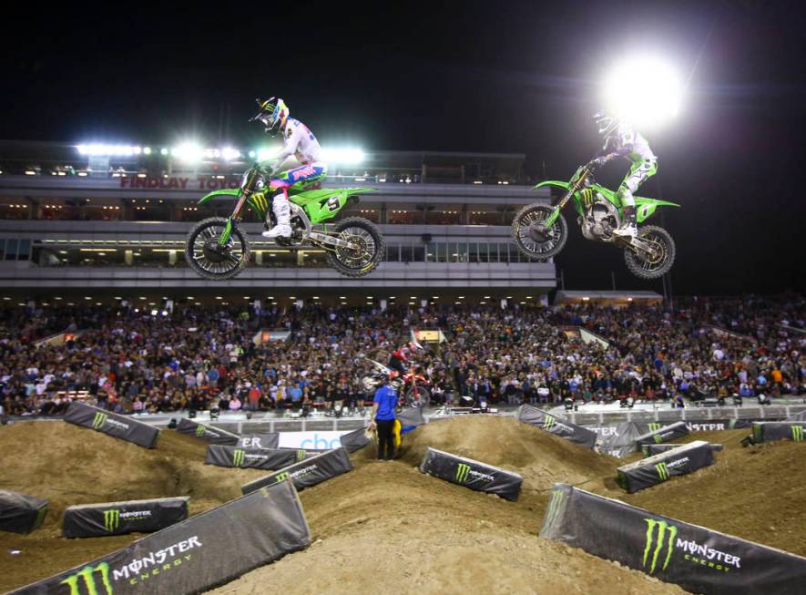 Adam Cianciarulo (9) leads the race past Eli Tomac (1) during the third main event of the Monst ...