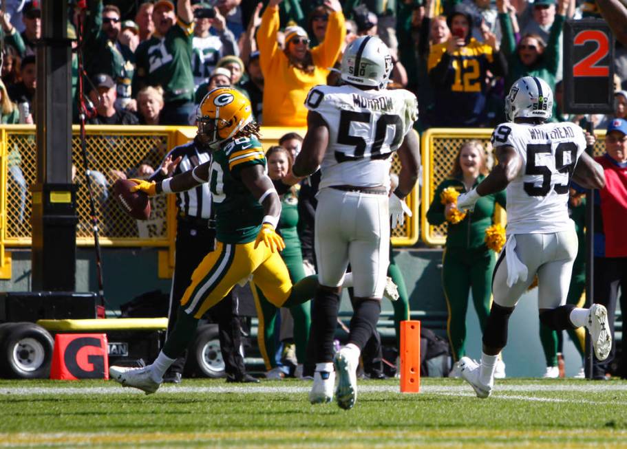 Green Bay Packers running back Jamaal Williams (30) runs in to the end zone as Oakland Raiders ...