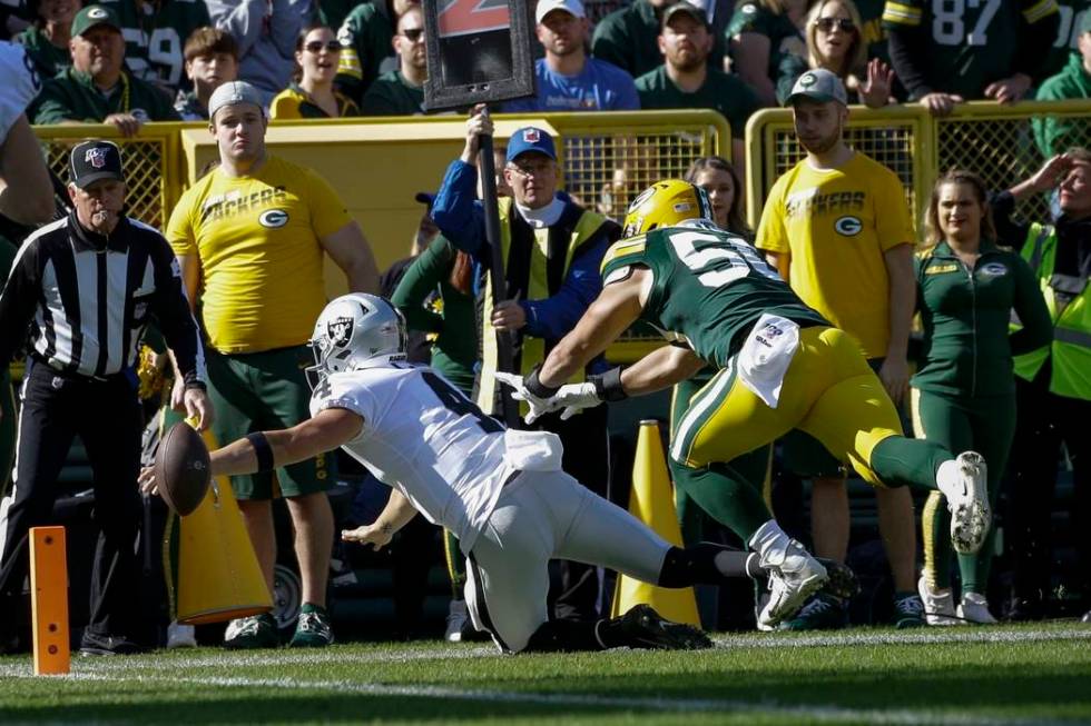 Oakland Raiders' Derek Carr loses the ball as he reaches for the end zone during the first half ...