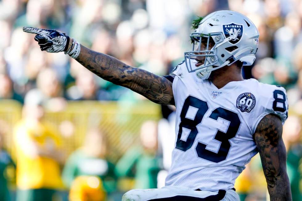 Oakland Raiders' Darren Waller reacts after catching a pass during the first half of an NFL foo ...