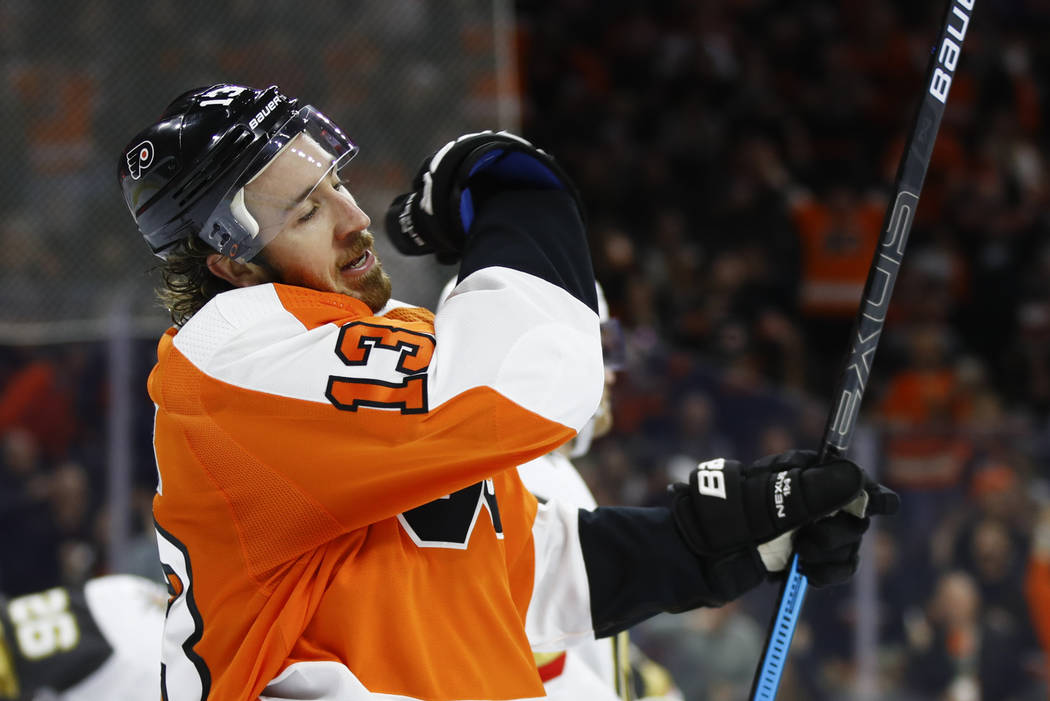 Philadelphia Flyers' Michael Raffl (12) scores against Vegas Golden Knights' Oscar Dansk, left, ...