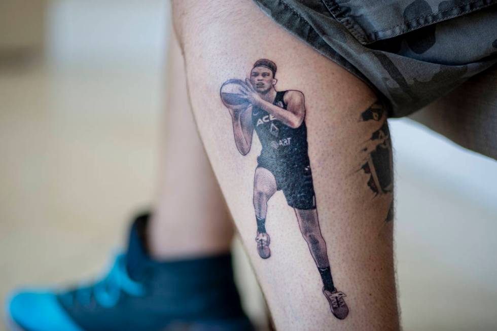 Local sports fan Trevor La Porte shows his recent tattoo of Las Vegas Aces player Dearica Hamby ...