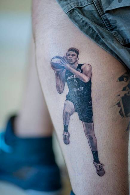 Local sports fan Trevor La Porte shows his recent tattoo of Las Vegas Aces player Dearica Hamby ...