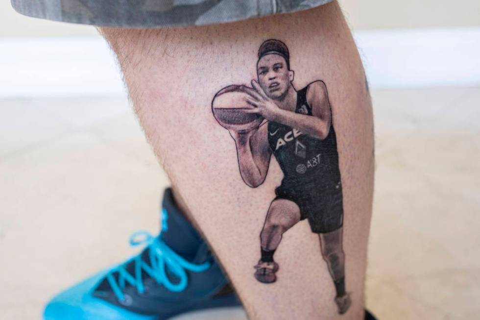 Local sports fan Trevor La Porte shows his recent tattoo of Las Vegas Aces player Dearica Hamby ...