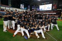 Houston Astros pose after winning Game 6 of baseball's American League Championship Series agai ...