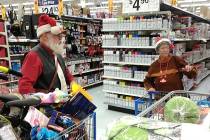 Fred Summers and his wife Patty fill their shopping carts with a variety of toys during their C ...