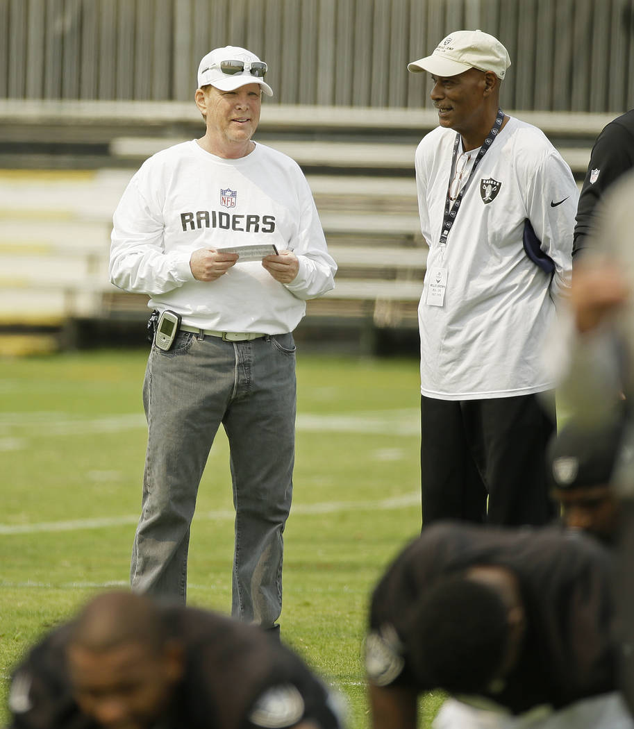 Oakland Raiders owner Mark Davis, left, and Hall of Fame cornerback Willie Brown, right, during ...