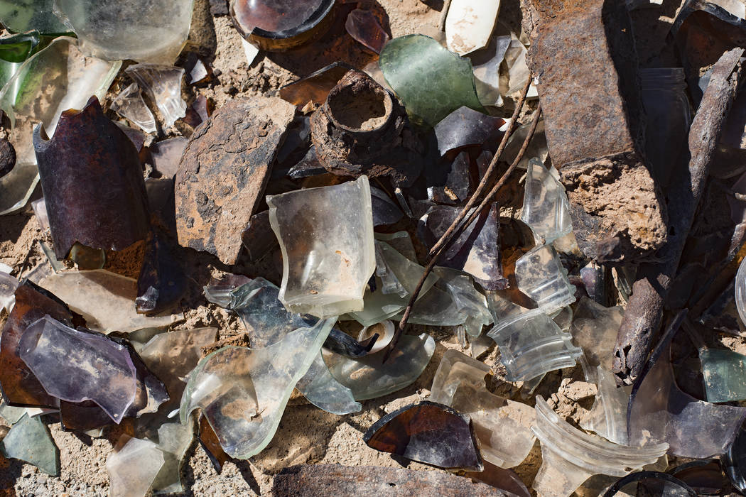 Cracked bottles and debris on the ground in St. Thomas, in the Lake Mead National Recreation Ar ...