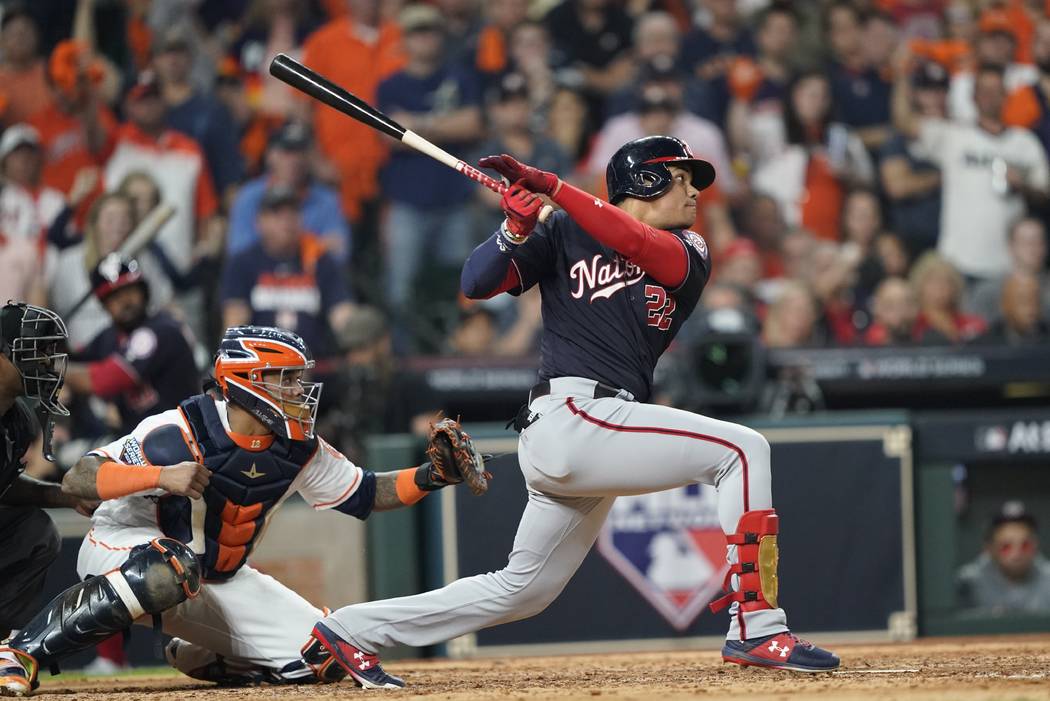 Washington Nationals' Juan Soto hits a two-run scoring double during the fifth inning of Game 1 ...