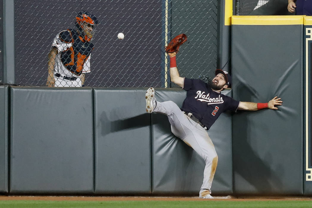 Washington Nationals right fielder Adam Eaton can't get a glove on a RBI-double by Houston Astr ...