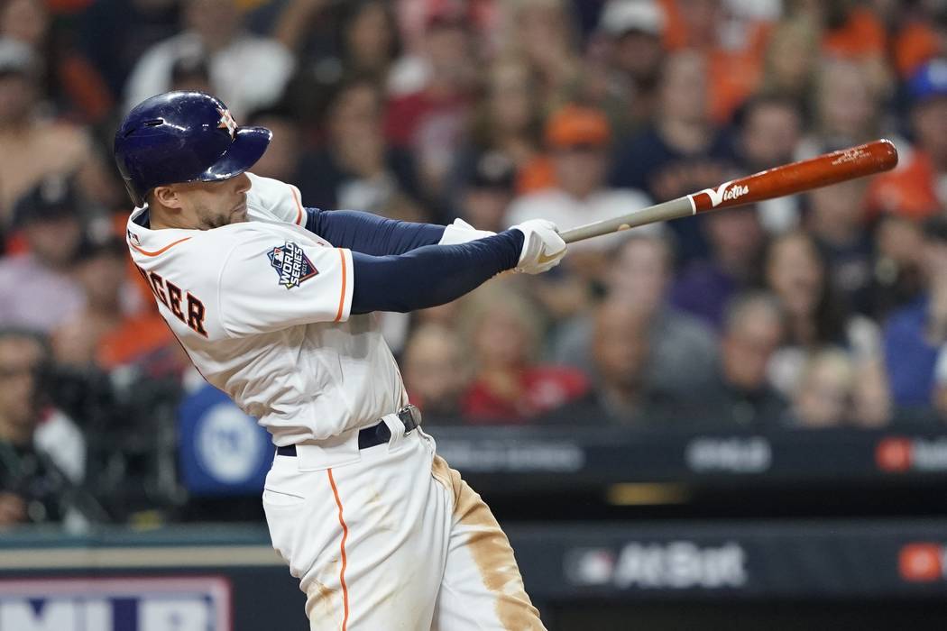 Houston Astros' George Springer hits a home run during the seventh inning of Game 1 of the base ...