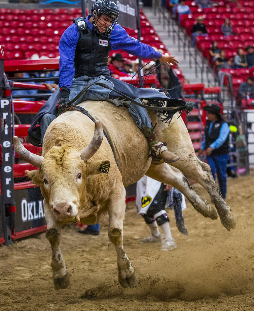 Bull rider Riel Bruised Head holds tight onto his bull during the first round of the Indian Nat ...