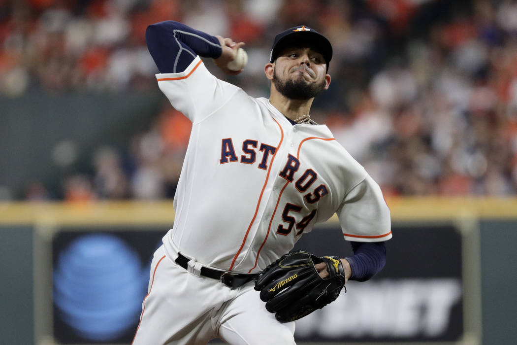 Houston Astros relief pitcher Roberto Osuna throws against the New York Yankees during the eigh ...