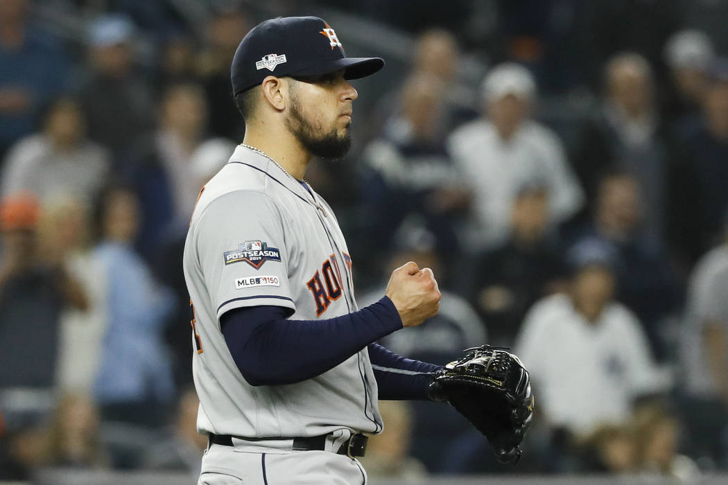 Houston Astros relief pitcher Roberto Osuna celebrates after their 4-1 win against the New York ...