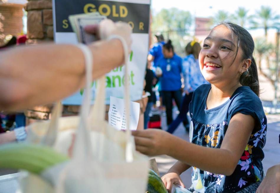 Helen Herr Elementary student Priscila Escobedo, 10, sells their garden club's produce during t ...