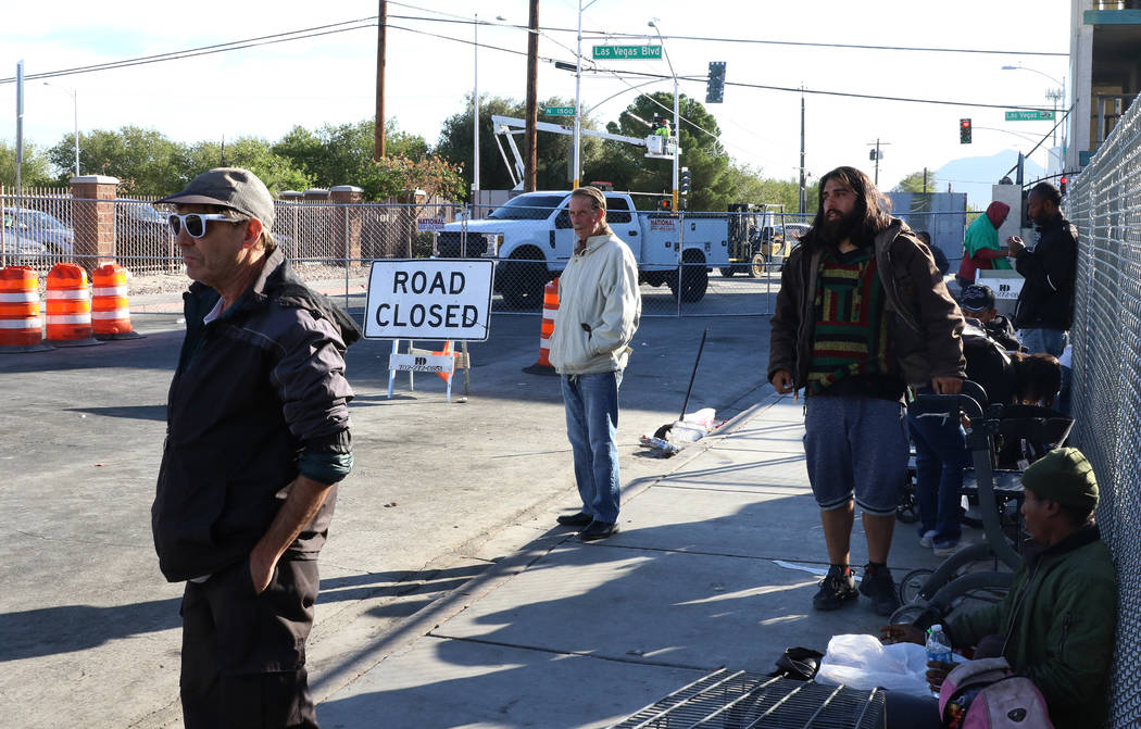 Road closure sign is seen as clients, including Bobby B., 68, center, hangout outside the Court ...