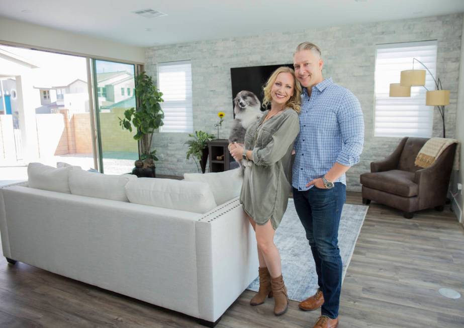 "Le Rev" star Erika Tomlinson and her fiancé James Hayes with Neptune, their rescue Pomeranian ...