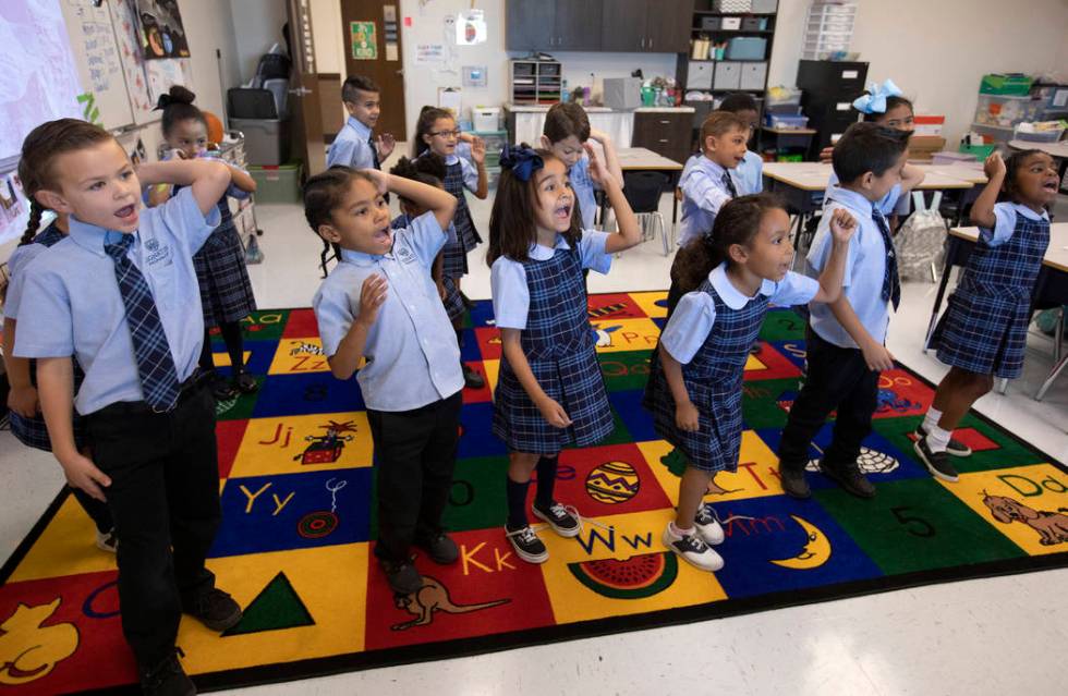 A second grade classroom at Signature Preparatory dances to their "morning song," which aims to ...