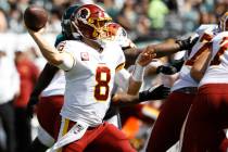 Washington Redskins' Case Keenum in action during the first half of an NFL football game agains ...