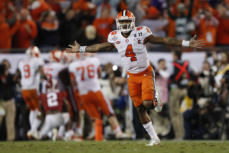 Clemson's Deshaun Watson celebrates a last second touchdown pass to Hunter Renfrow during the s ...