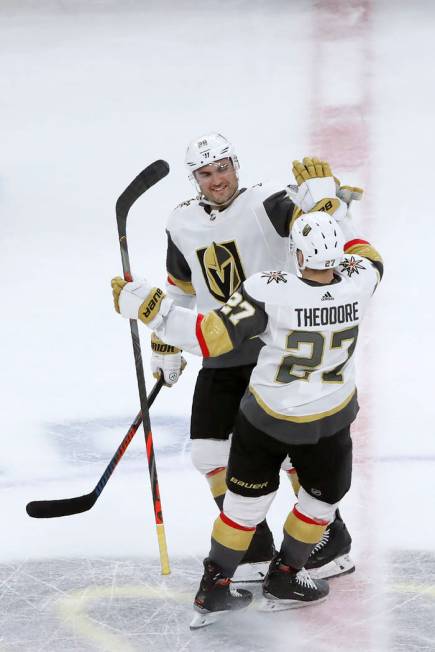 Vegas Golden Knights left wing William Carrier (28) celebrates with Shea Theodore after Theodor ...