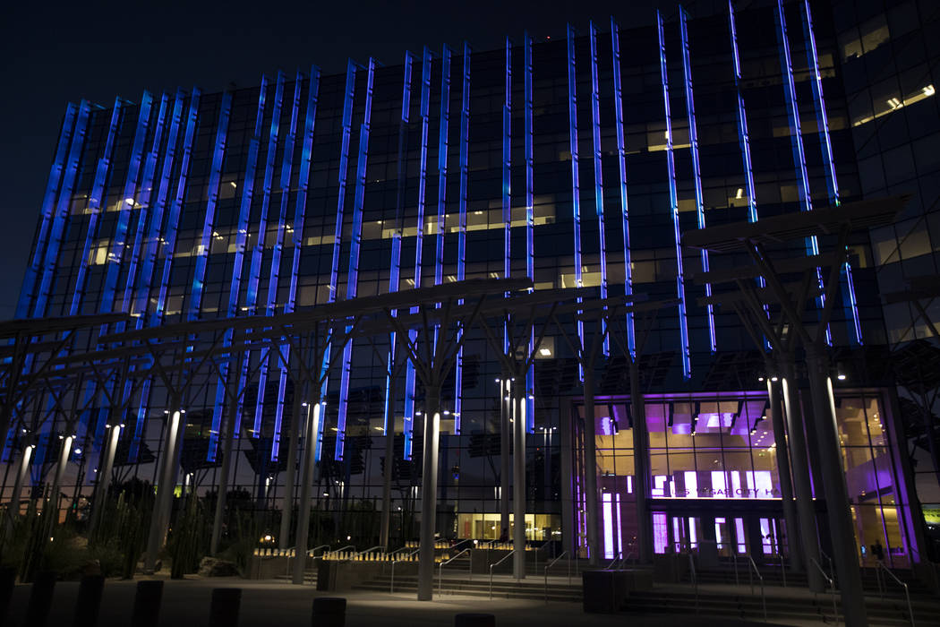 City Hall is lit purple in honor of domestic violence victims in Las Vegas, Thursday, Oct. 24, ...