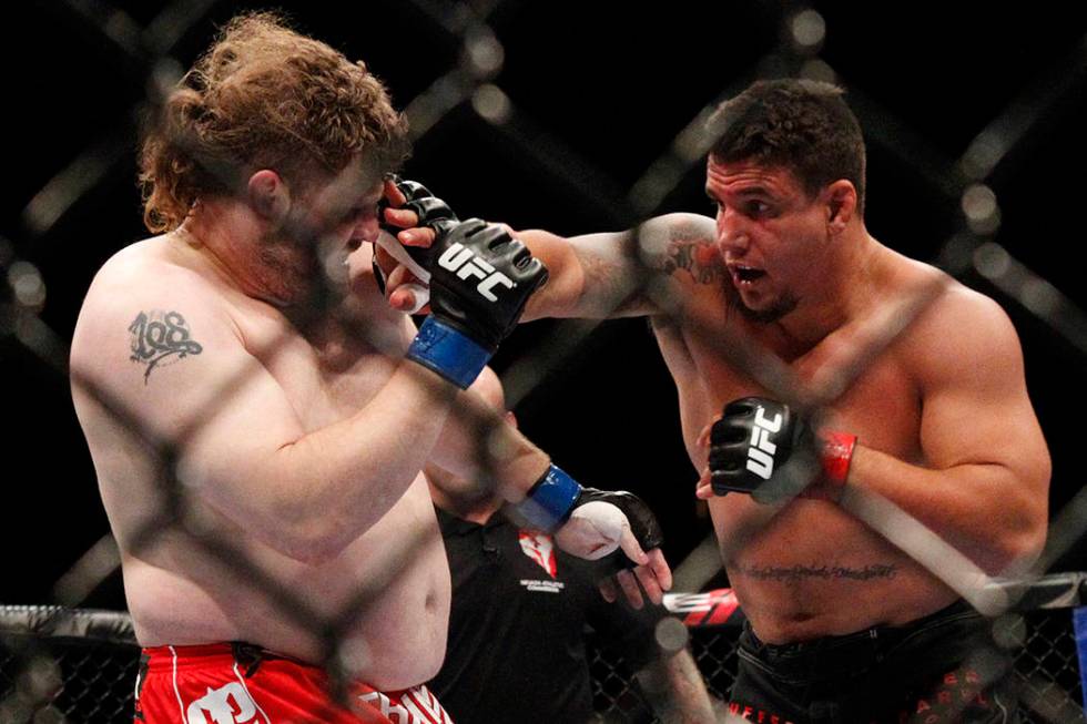 Frank Mir, right, fights Roy Nelson in their heavyweight bout at UFC 130 at the MGM Grand in La ...