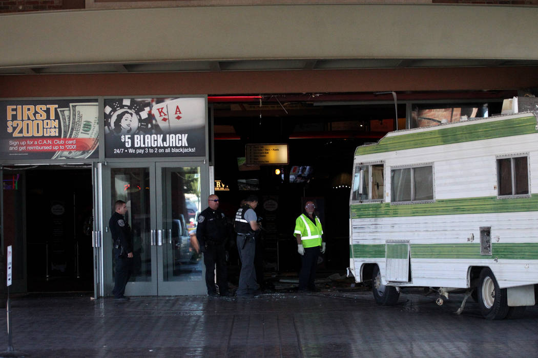 North Las Vegas Police Department officers investigate after a woman crashed her RV into the Ca ...