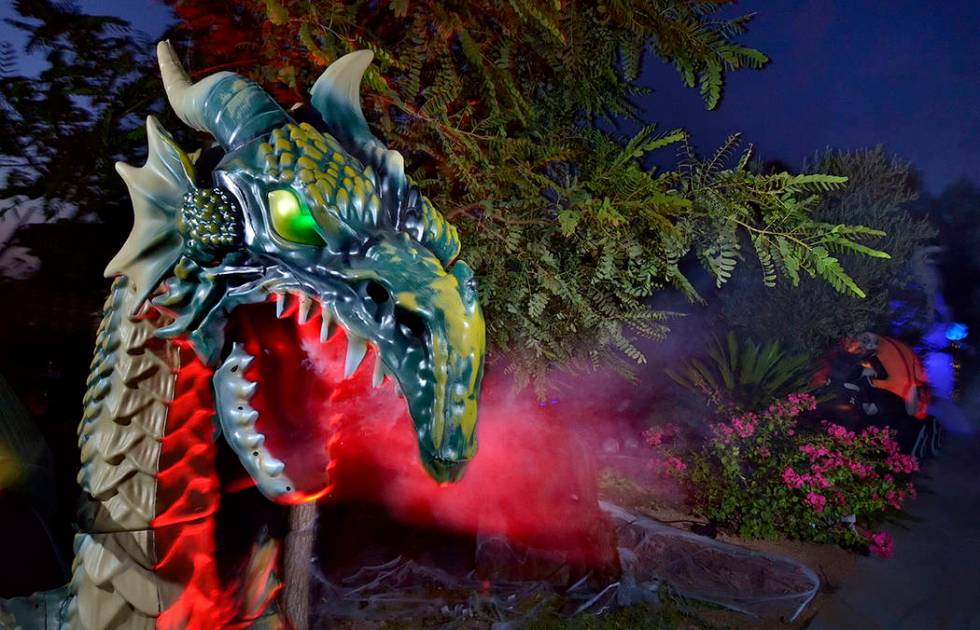 A fire-breathing dragon is part of Carmine Vento's Halloween display. (Bill Hughes Real Estate ...