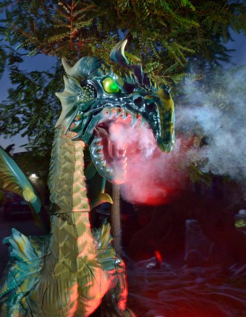 A fire-breathing dragon is part of Carmine Vento's Halloween display. (Bill Hughes Real Estate ...