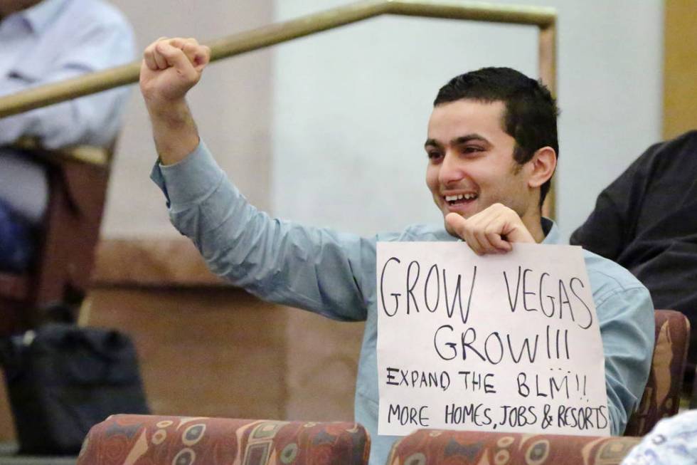 Cyrus Hojjaty shows his support of a resolution seeking federal legislation to open 44,000 acre ...