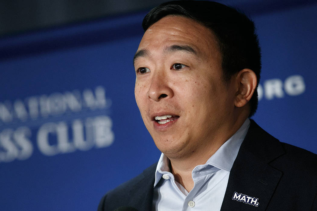 Wearing a pin that says "math," Democratic presidential candidate entrepreneur Andrew ...