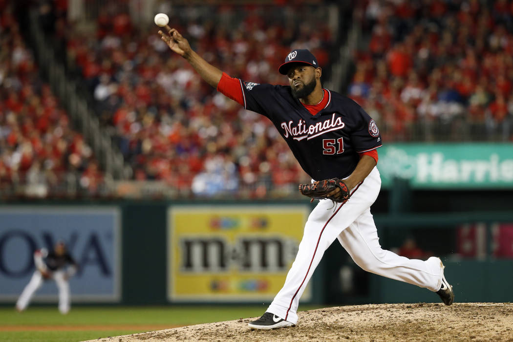 Washington Nationals pitcher Wander Suero throws against the Houston Astros during the ninth in ...