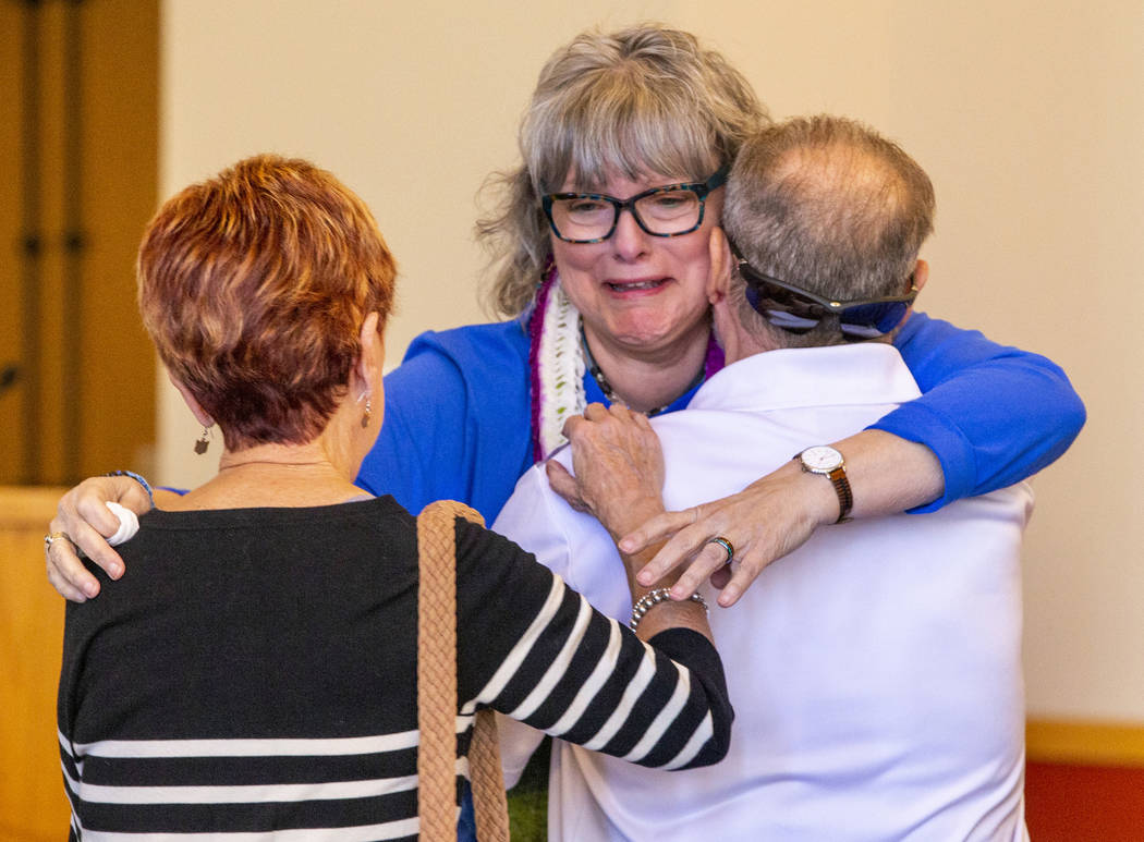 Grandmother Kathleen Wheeler weeps while being comforted at the funeral service for her grandso ...