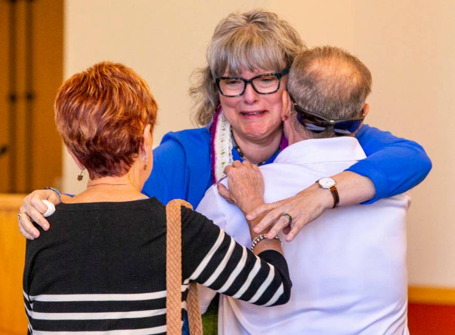 Grandmother Kathleen Wheeler weeps while being comforted at the funeral service for her grandso ...