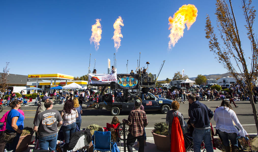 Flames shoot out from the Controlled Burn art car during the annual Nevada Day Parade in Carson ...