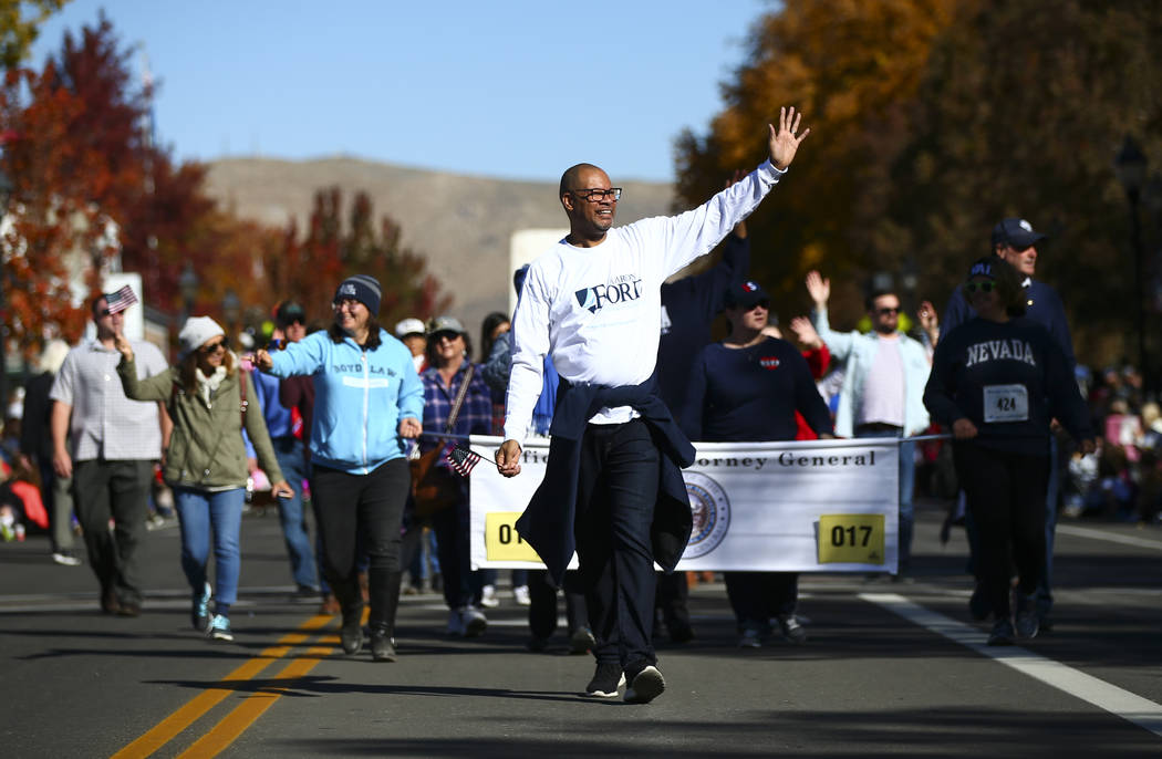Attorney General Aaron Ford waves to the crowd during the annual Nevada Day Parade in Carson Ci ...