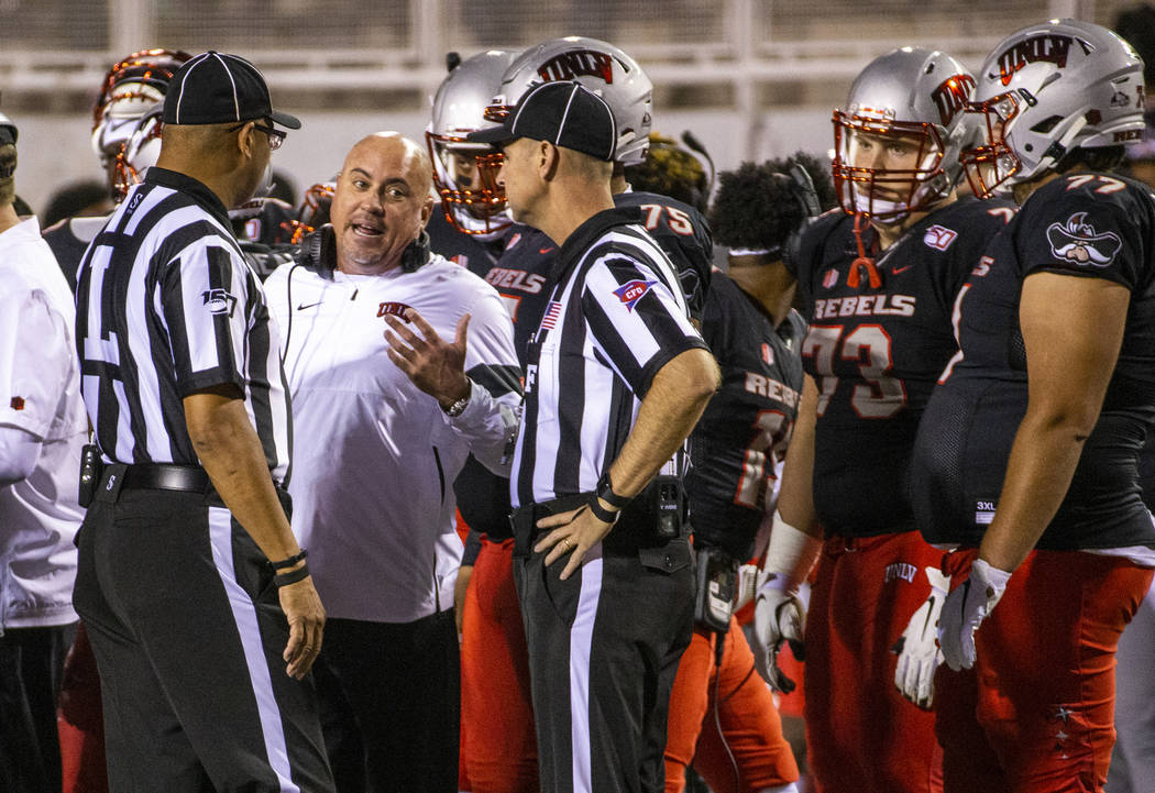 UNLV Rebels head coach Tony Sanchez pleads his case for a call against the San Diego State Azte ...