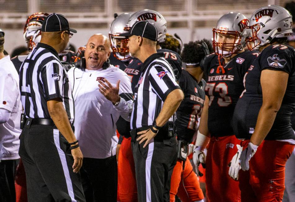 UNLV Rebels head coach Tony Sanchez pleads his case for a call against the San Diego State Azte ...