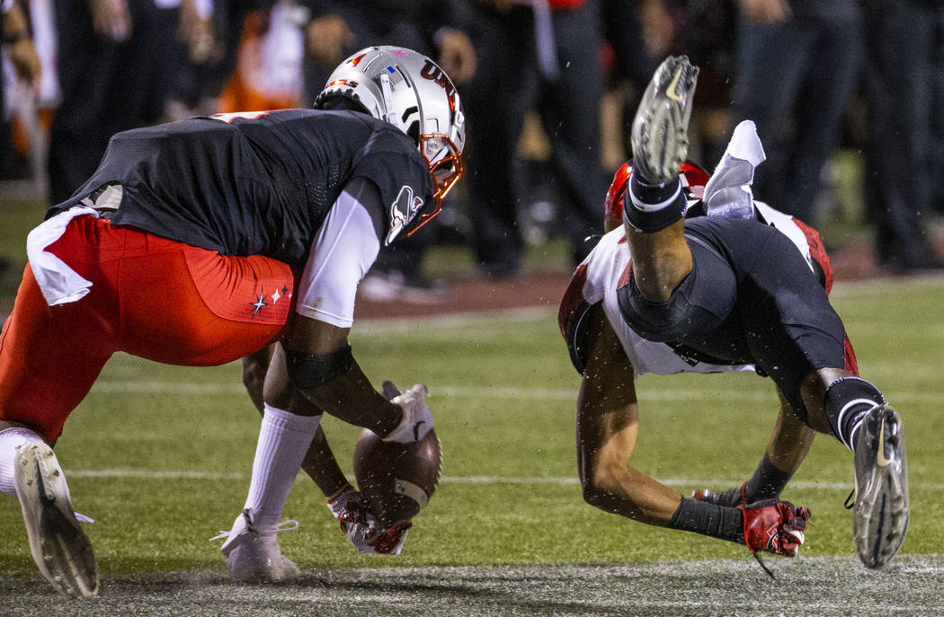 UNLV Rebels wide receiver Randal Grimes (4) makes a difficult catch as San Diego State Aztecs c ...