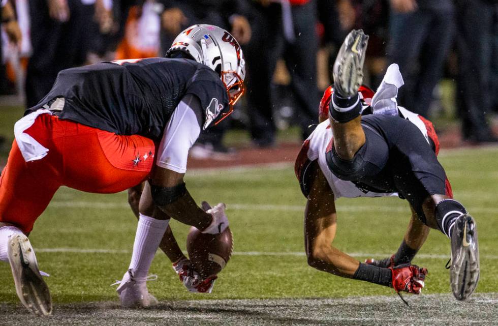 UNLV Rebels wide receiver Randal Grimes (4) makes a difficult catch as San Diego State Aztecs c ...