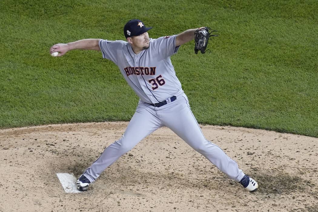 Houston Astros relief pitcher Will Harris throws during the sixth inning of Game 4 of the baseb ...