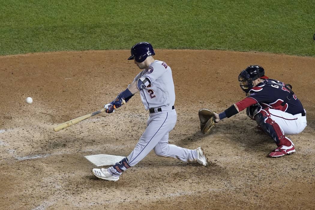 Houston Astros' Alex Bregman hits a grand slam during the seventh inning of Game 4 of the baseb ...