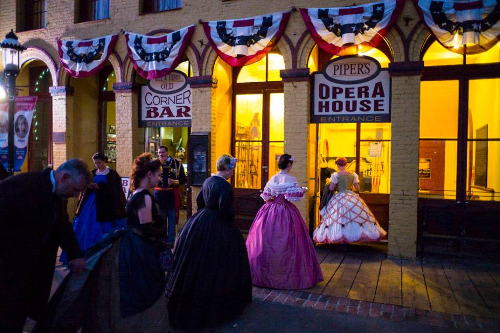 Attendees in period outfits arrive at Piper's Opera House for the Nevada Statehood Ball in Virg ...