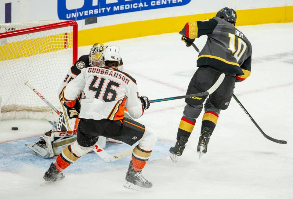 Vegas Golden Knights center Nicolas Roy (10) scores his first goal over Anaheim Ducks goaltende ...